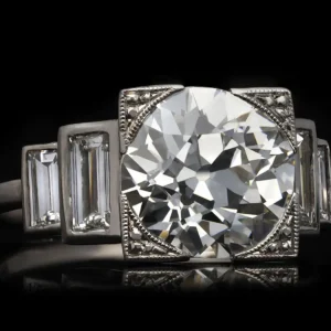 Art Deco diamond flanked solitaire ring, English, circa 1930.
